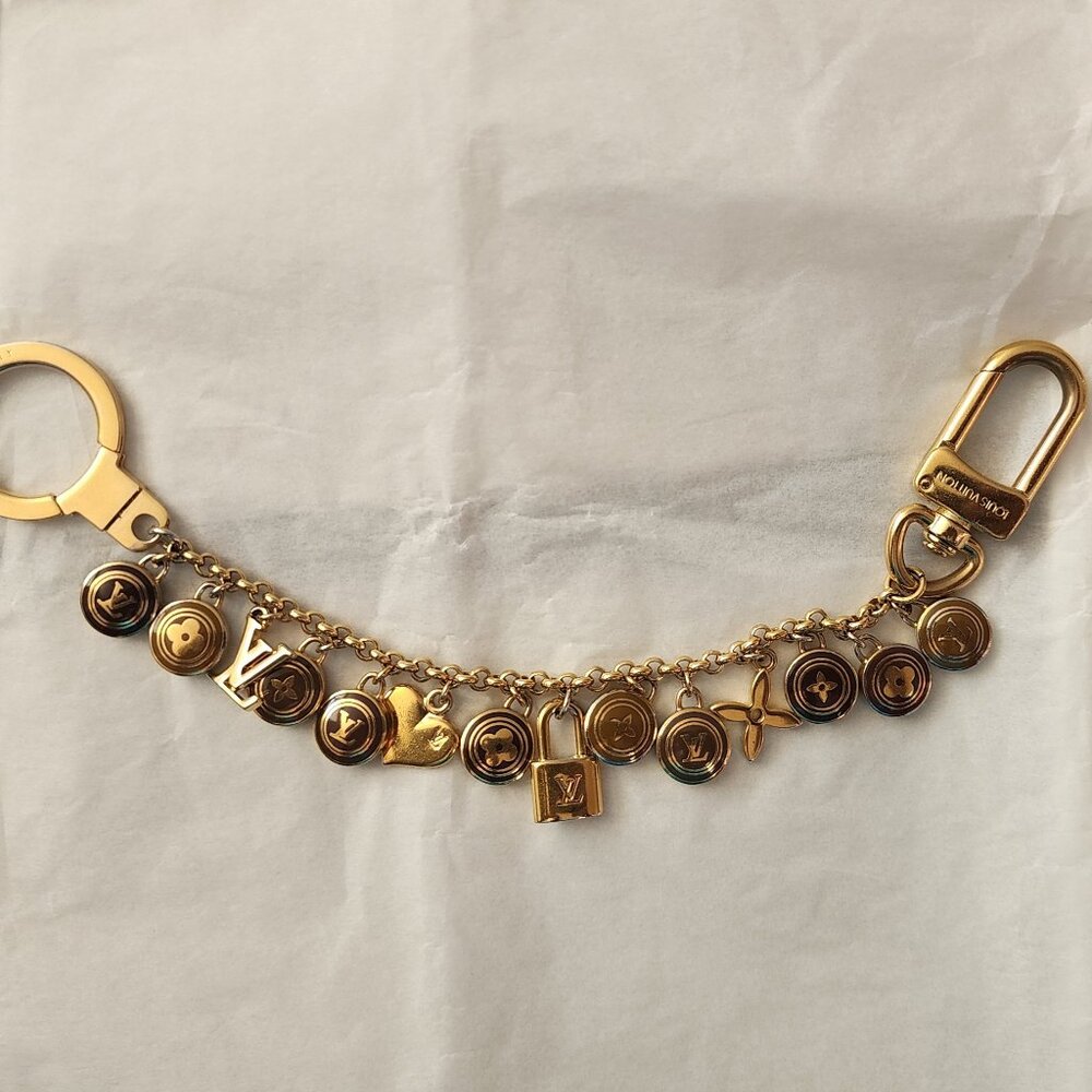 LOUIS VUITTON - AUTHENTIC, VINTAGE, AND RARE LOGO CHARM BRACELET